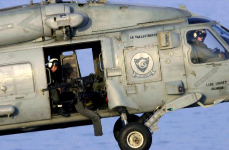 US Navy 030822-N-9319H-007 A helicopter assigned to the Indians of Anti-Submarine Warfare Helicopter Squadron Six (HS-6), participates in an aerial force protection mission while transiting through the Straights of Hormuz
