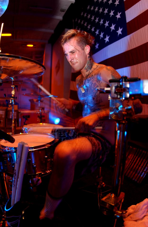 US Navy 030827-N-8273J-010 Drummer Travis Barker, of the rock bank Blink-182, performs for the crewmembers of USS Nimitz (CVN 68) and Carrier Air Wing Eleven (CVW-11)