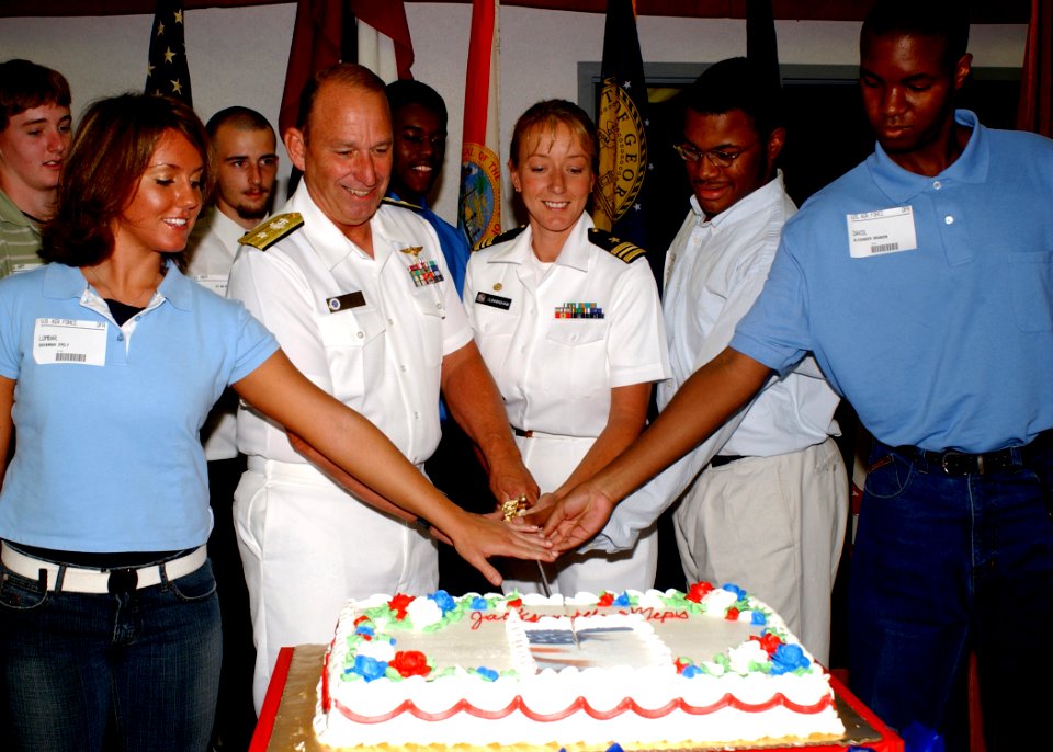 US Navy 030701-N-7041B-001 Rear Adm. Donald K. Bullard, Commander Carrier Group Six, shares in a cake cutting ceremony with newly sworn service