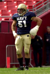 US Navy 031004-N-9693M-846 Navy linebacker Bobby McClarin played despite an injured left hand, which was bandaged
