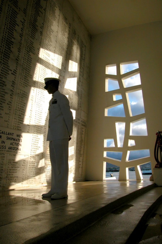 US Navy 030828-N-9909C-002 Chief Journalist Tim Paynter scans the names of 1,177 Sailors and Marines who lost their lives during the Dec. 7, 1941 attack on Pearl Harbor in the shrine room of the USS Arizona Memorial