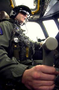 US Navy 031003-N-6536T-004 Lt. Paul Flores pilots an E-2 Hawkeye