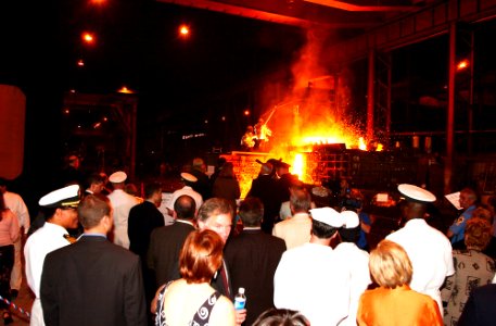 US Navy 030909-N-9954T-003 Workers pour steel into a mold to form the bow stem of the Amphibious Transport Dock ship USS New York (LPD 21) as guests watch