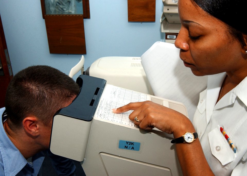 US Navy 030906-N-8100M-001 Hospital Corpsmen 3rd Class Latara Hall examines a patient