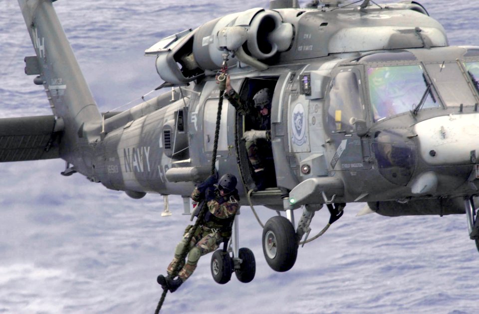 US Navy 031017-N-1577S-002 Explosive Ordinance Disposal Mobile Unit Eleven Detachment One (EOD MU11 DET 1) fast ropes out of a HH-60H Seahawk