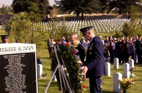 US Navy 030911-N-9593R-008 Secretary of Defense Donald Rumsfeld, left, and Gen. Richard Myers, Chairman of the Joint Chiefs of Staff, place a wreath at the Pentagon Memorial in the Arlington National Cemetery on Sept. 11, 2003