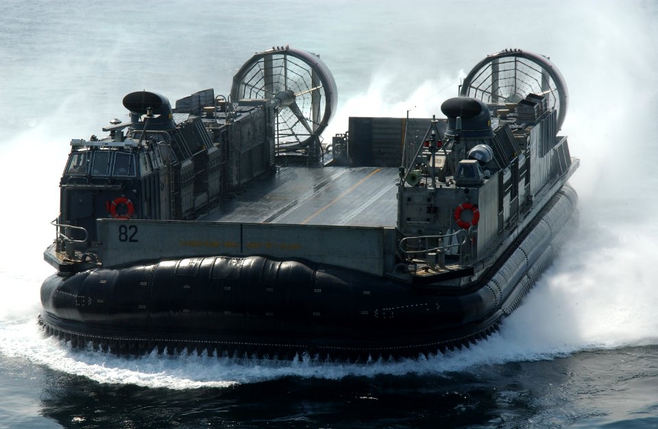 US Navy 031012-N-3236B-003 A Landing Craft Air Cushion (LCAC) assigned to Assault Craft Unit Five (ACU-5) from Camp Pendleton, Calif., enters the well deck of the Amphibious Assault ship USS Peleliu (LHA 5)