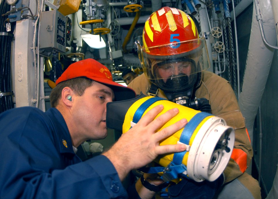 US Navy 031021-N-8955H-003 Sailors are training on how to use the Naval Firefighting Thermal Imager (NFTI) during a General Quarters training drill aboard USS Blue Ridge (LCC 19)