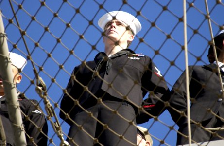 US Navy 031024-N-5319A-005 Sailors man the rails as the amphibious assault ship USS Iwo Jima (LHD 7) returns to Naval Station Norfolk after an eight-month deployment in support of Operation Iraqi Freedom