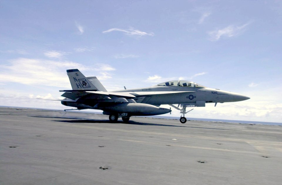 US Navy 030929-N-2385R-002 USS Nimitz (CVN 68) Commanding Officer, Capt. Robert J. Gilman and Lt. Cmdr. Kevin Aanestad complete an arrested landing