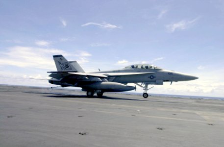 US Navy 030929-N-2385R-002 USS Nimitz (CVN 68) Commanding Officer, Capt. Robert J. Gilman and Lt. Cmdr. Kevin Aanestad complete an arrested landing