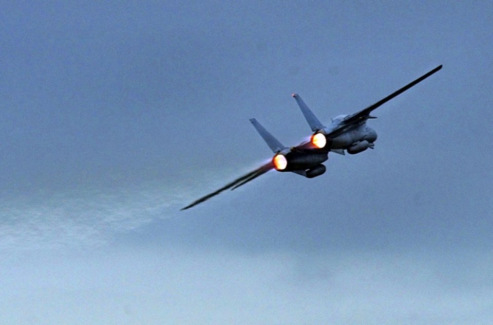 US Navy 030924-N-5961C-003 An F-14 Tomcat assigned to the Black Knights of Fighter Squadron One Five Four (VF-154) departs Naval Air Facility Atsugi, Japan