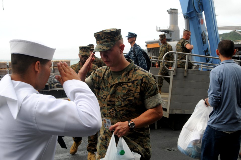 US Navy 100906-N-5215E-158 Marines board USS Essex (LHD 2) at White Beach Naval Facility in Okinawa, Japan