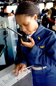 US Navy 030910-N-5471P-009 Ens. Nicole Paul queries a simulated foreign ship while conducting Maritime Interdiction Operations (MIO) boardings, aboard the guided missile cruiser, USS Philippine Sea (CG 58)