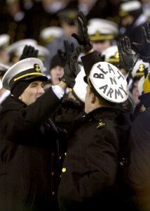 US Navy 031206-N-9693M-519 U.S. Naval Academy Midshipmen high-five each other to celebrate a Navy play during the 104th Army Navy game