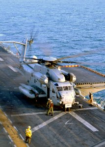 US Navy 031006-N-6895M-002 A CH-53 Sea Stallion lifts off from the flight deck of USS Peleliu (LHA 5)