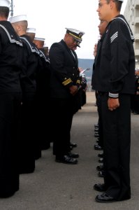 US Navy 031007-N-8937A-024 Lt. Cmdr. Stanley Keeve, Commanding Officer, USS Guardian (MCM 5), conducts a dress blue uniform inspection pierside along India Basin