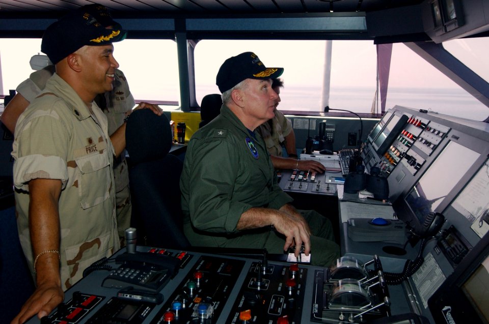 US Navy 031010-N-3236B-003 Adm. Bob Conaway, Commander, Expeditionary Strike Group One (ESG-1), pilots High Speed Vessel Two (HSV 2) while touring the vessel in the Northern Arabian Gulf