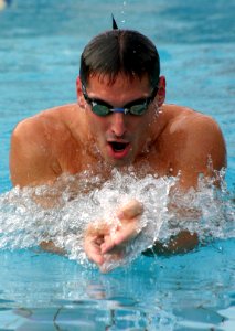 US Navy 031112-N-5821W-001 Lt. Ian Johnston, assigned to NAS Sigonella's Tactical Support Center practices the breast stroke in NAS Sigonella's NAS II pool