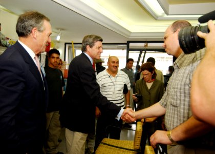 US Navy 031014-N-4374S-001 Ambassador L. Paul Bremer III, Administrator of the Coalition Provisional Authority in Iraq, greets the owner of Al-Mathaly Computer Store with U.S. Secretary of Commerce Donald Evans