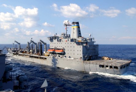 US Navy 031016-N-5821P-002 USNS Yukon (T-AO 202) steams alongside USS Kitty Hawk (CV 63) during a replenishment-at-sea (RAS) evolution