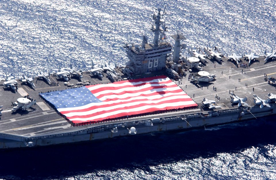 US Navy 031103-N-6536T-005 USS Nimitz (CVN 68) and Carrier Air Wing Eleven (CVW-11) personnel participate in a flag unfurling rehearsal