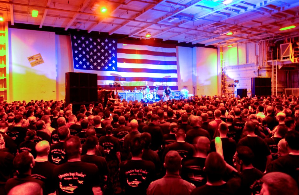 US Navy 030827-N-8273J-011 The rock bank Blink-182 performs for the crewmembers aboard USS Nimitz (CVN 68) during a United Services Organization (USO) show