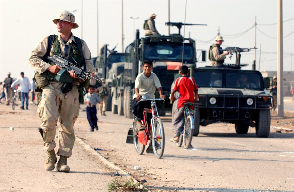US Navy 031016-N-3236B-043 A marine patrols the streets of Al Faw, Iraq