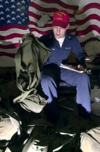 US Navy 031016-N-1577S-003 Damage Controlman 3rd Class Todd Williams from Palmdale, Calif., logs in a MCU2P gas mask