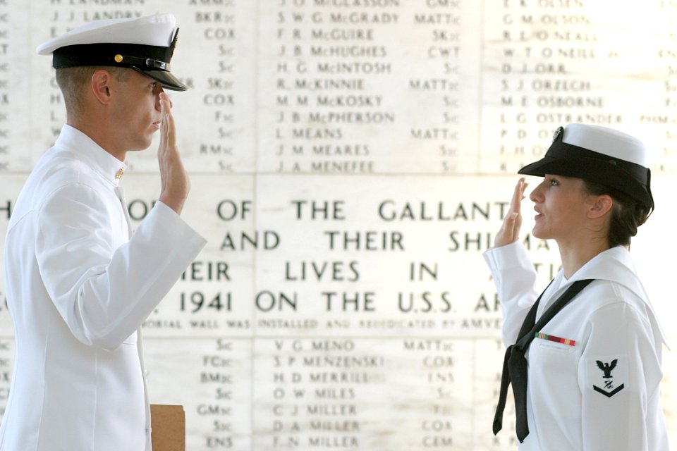 US Navy 030828-N-3228G-001 Journalist 3rd Class Sunday Williams of Navy Region Hawaii Public Affairs, reenlists in the shrine room on board the USS Arizona Memorial by her leading chief petty officer