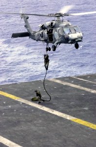 US Navy 031017-N-2143T-002 Explosive Ordinance Disposal Mobile Unit Eleven Detachment One (EOD MU11 DET 1) fast ropes out of a HH-60H Seahawk