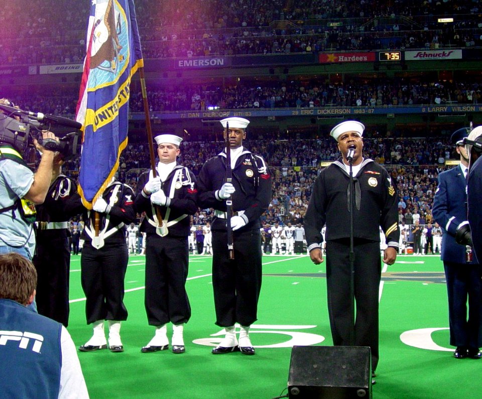 US Navy 031109-N-0000X-001 Navy Counselor 1st Class Gerald Wilson, assigned to Naval Reserve Recruiting Region West, performs the National Anthem at the Edward Jones Dome, St. Louis, as part of the Veterans' Day pre-game ceremo