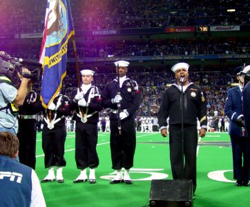 US Navy 031109-N-0000X-001 Navy Counselor 1st Class Gerald Wilson, assigned to Naval Reserve Recruiting Region West, performs the National Anthem at the Edward Jones Dome, St. Louis, as part of the Veterans' Day pre-game ceremo