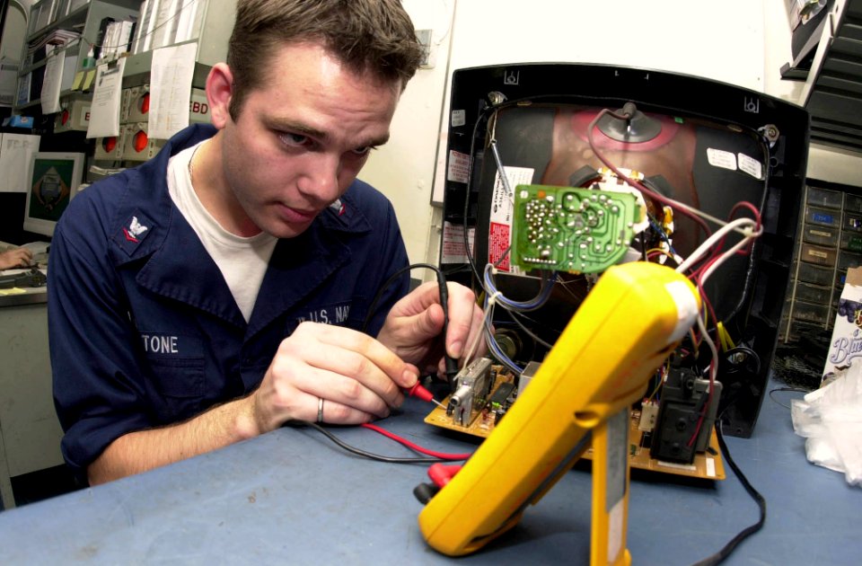 US Navy 031016-N-2143T-002 Interior Communications Electrician 3rd Class Jonathan Livingstone from St. Louis, Mo., takes resistance readings on wires