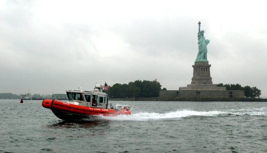 US Navy 030902-C-3948H-510 A U.S. Coast Guard Rigid Hull Inflatable Boat (RHIB) conducts a Homeland Security patrol near the Statue of Liberty