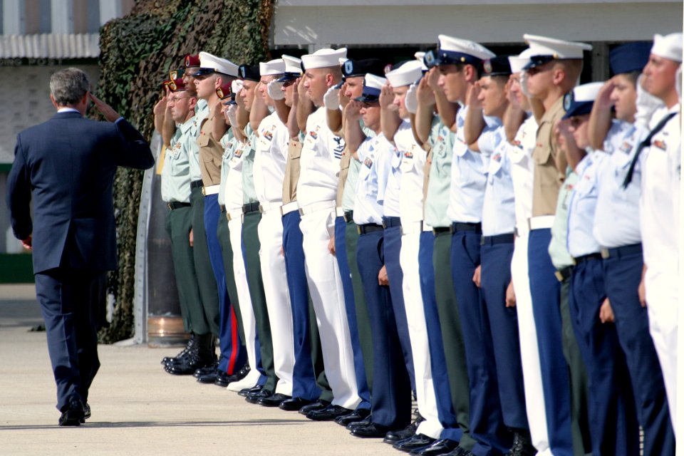 US Navy 031023-N-3228G-005 President George W. Bush returns the salute of Hawaii-based Operation Iraqi Freedom veterans on the pier where the retired battleship Missouri (BB 63) is moored