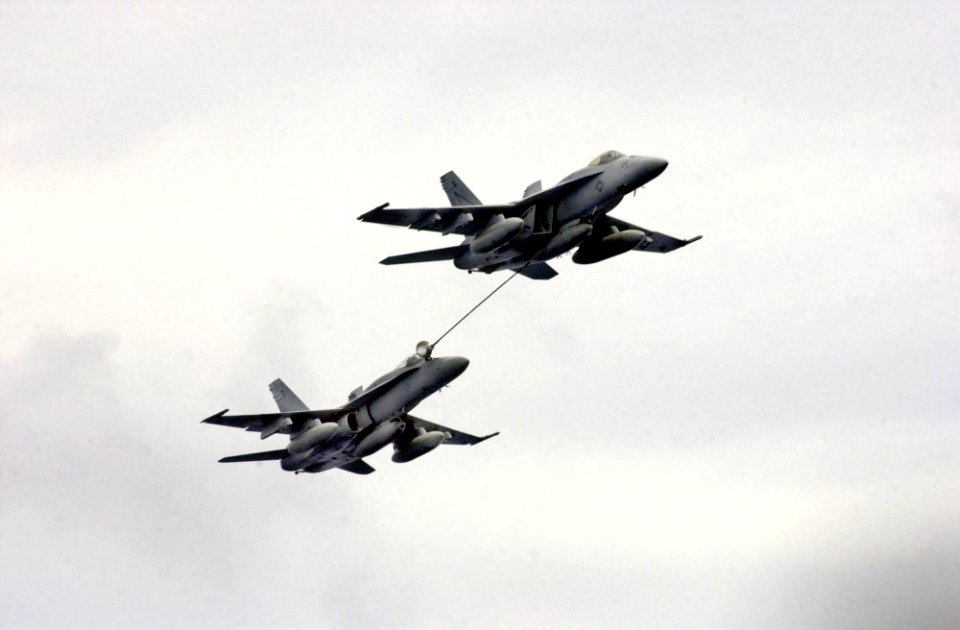 US Navy 031005-N-2143T-002 Two F-A-18 Hornets refuel