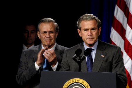 US Navy 031124-D-2987S-058 Secretary of Defense Donald H. Rumsfeld applauds President George W. Bush
