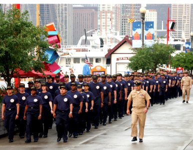 US Navy 030908-N-0606B-001 Senior Chief Damage Controlman Robert Tadej and Senior Chief Hospital Corspman Dan Rogers lead 130 Chief Petty Officer selectees from Naval Station Great Lakes down Navy Pier for morning colors