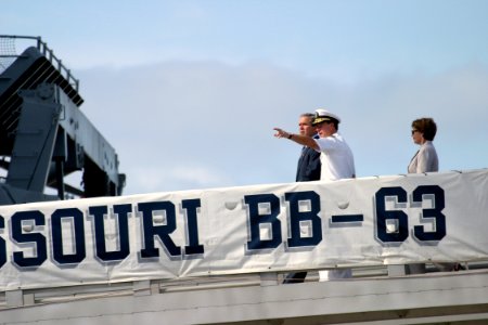 US Navy 031023-N-3228G-004 President George W. Bush and First Lady Laura Bush arrive with Commander U. S. Pacific Command, Adm. Thomas B. Fargo, aboard the retired battleship Missouri (BB 63)