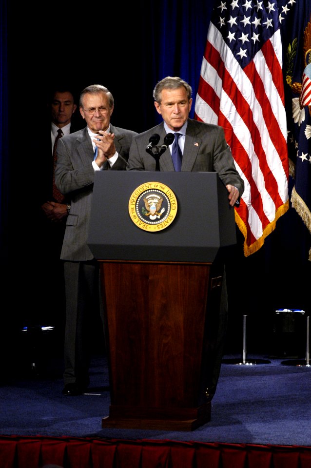 US Navy 031124-D-2987S-028 Secretary of Defense Donald H. Rumsfeld applauds while President George W. Bush makes remarks at the Pentagon