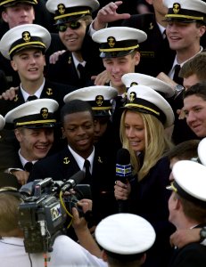 US Navy 031101-N-9693M-034 HDNet broadcaster Kandace Krueger (center right) interviews Midshipman 4th Class Michael Levinson (center left), from Willingboro, N.J., during Navy's 35-17 victory over Tulane