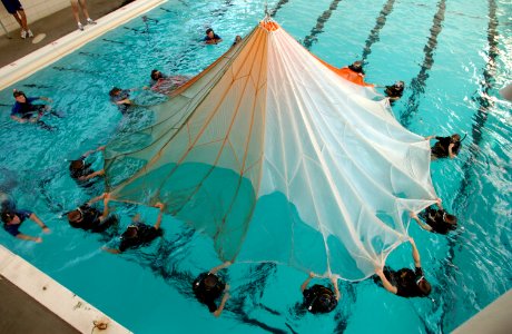 US Navy 031113-N-5862D-066 Students at the Aviation Rescue Swimmer School prepare to undergo a parachute disentanglement exercise