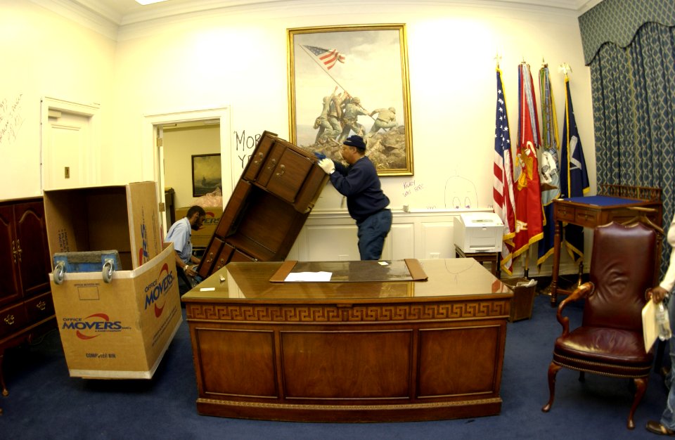 US Navy 031113-N-9693M-006 Office Mover employees move a credenza
