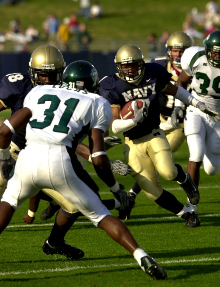 US Navy 031101-N-9693M-654 Navy slot back Trey Hines gains yardage during Navy's 35-17 victory over Tulane
