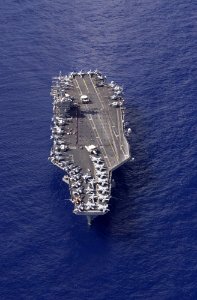 US Navy 031103-N-6536T-003 USS Nimitz (CVN 68) crewmembers participate in a flag unfurling rehearsal with the help of family and friends