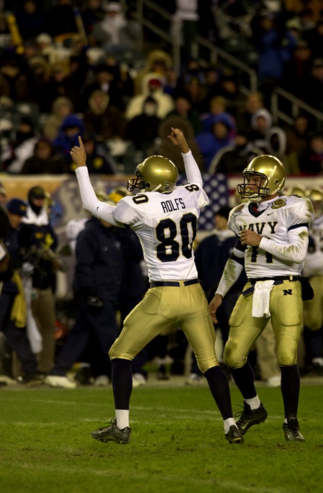 US Navy 031206-N-9693M-506 Navy kicker Eric Rolfs (80) celebrates a field goal with quarterback-holder Craig Candeto during the 104th Army Navy Game