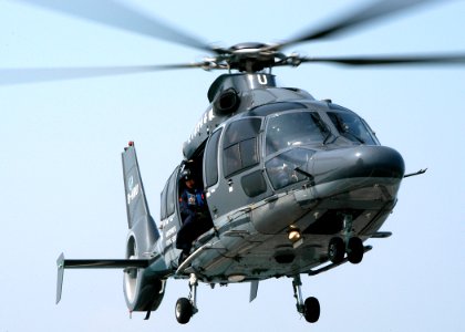 US Navy 031101-N-8955H-004 A Hong Kong Government Services EC 155 Dauphin helicopter hovers over the flight deck of USS Blue Ridge (LCC 19) during joint training with the Seventh Fleet Flag Ship in Hong Kong harbor