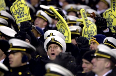 US Navy 031206-N-9693M-510 U.S. Naval Academy Midshipmen cheer for their football team during the 104th Army Navy Game photo
