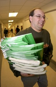 US Navy 031113-N-9693M-002 Senior Chief John Ledford moves files